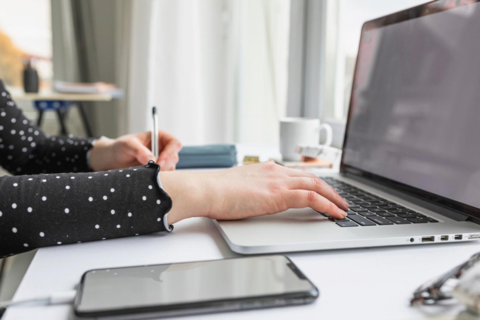 Department resource allocation meeting with priority matrix on whiteboard